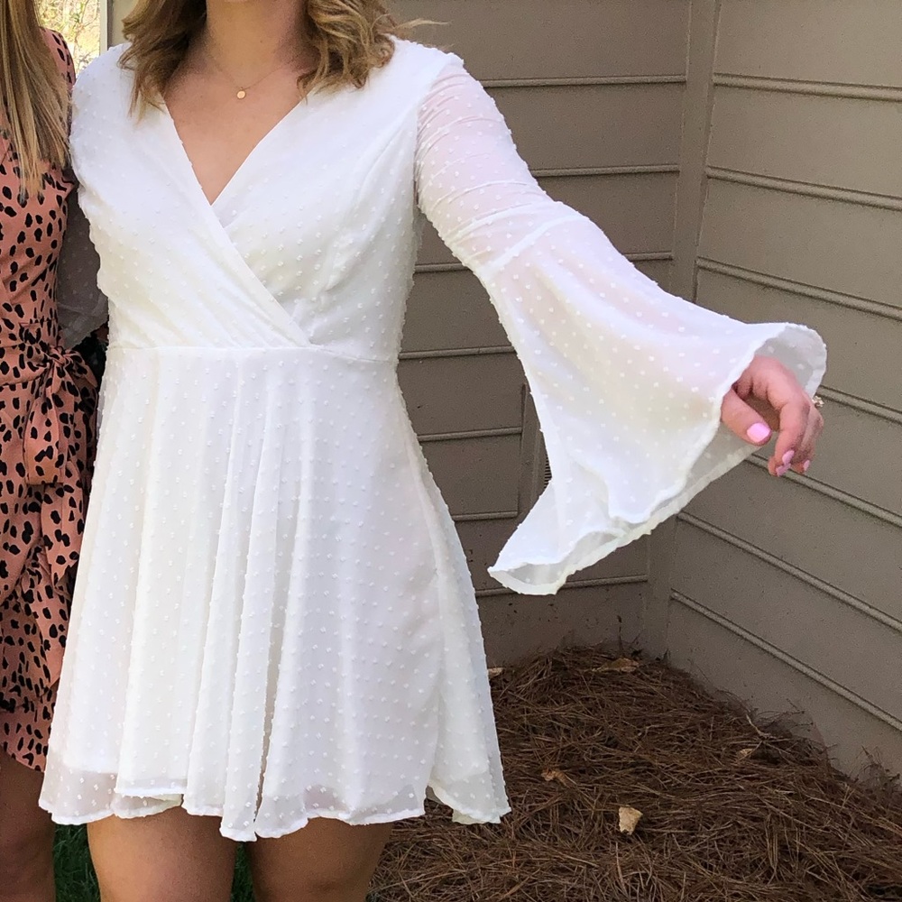White bell sleeved cocktail dress